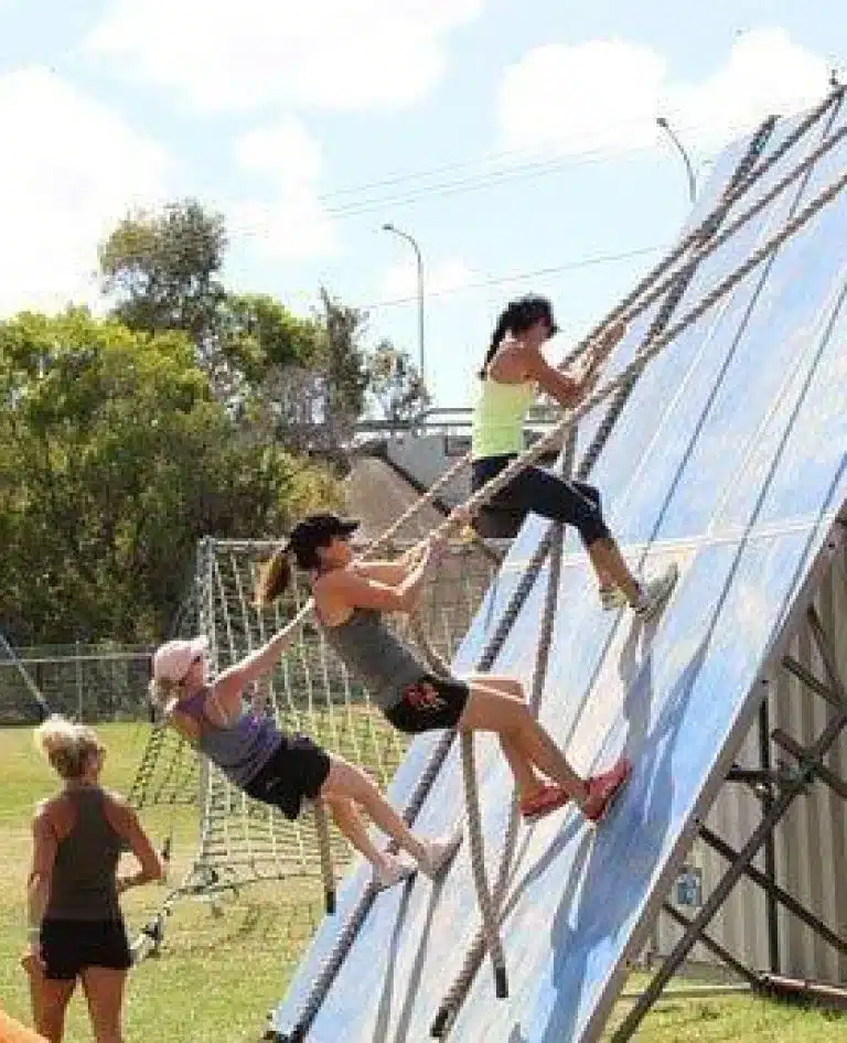 Using the ropes to climb up the wall