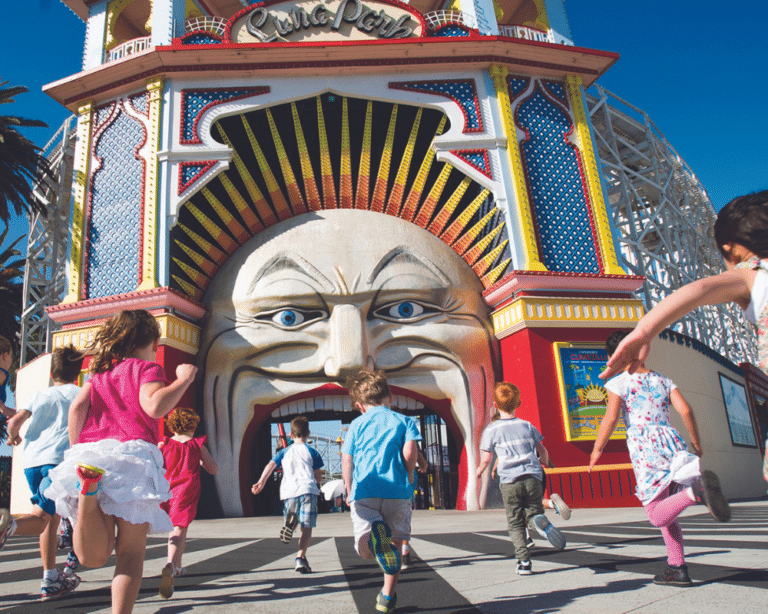 Children racing towards FUN at Luna Park Melbourne