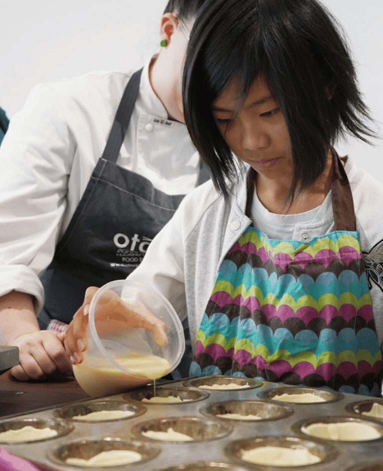 Girl baking at Holiday Cooking School