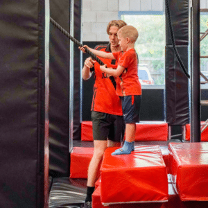 Boy taking the ropes at Ninja Jungle