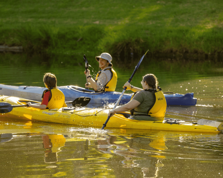 Kids getting active kayaking along the River Torrens.