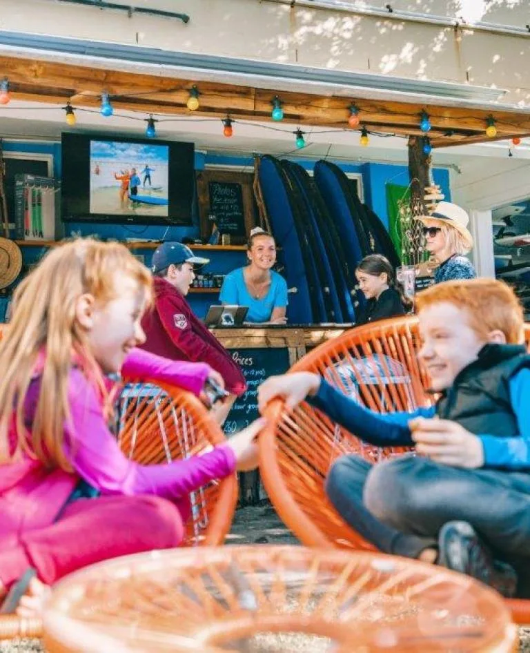 Kids enjoying a post surf catch up.