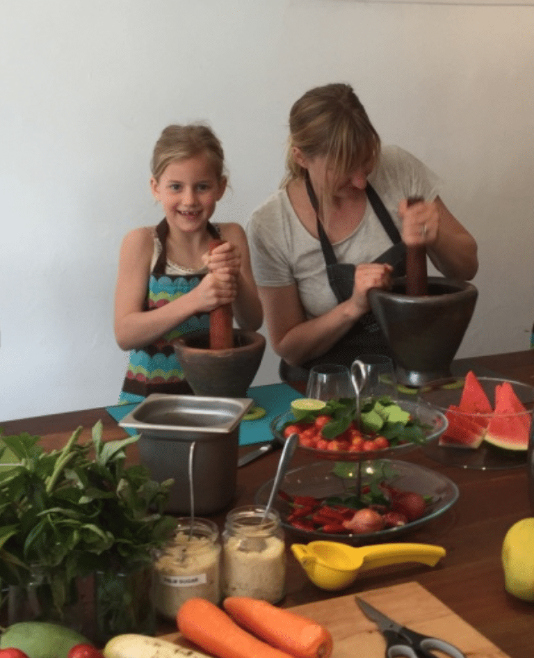 Mum and daughter having fun learning about new ingredients and meals.