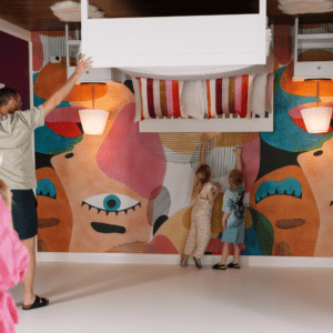 Children exploring the bedroom in the House Down Under