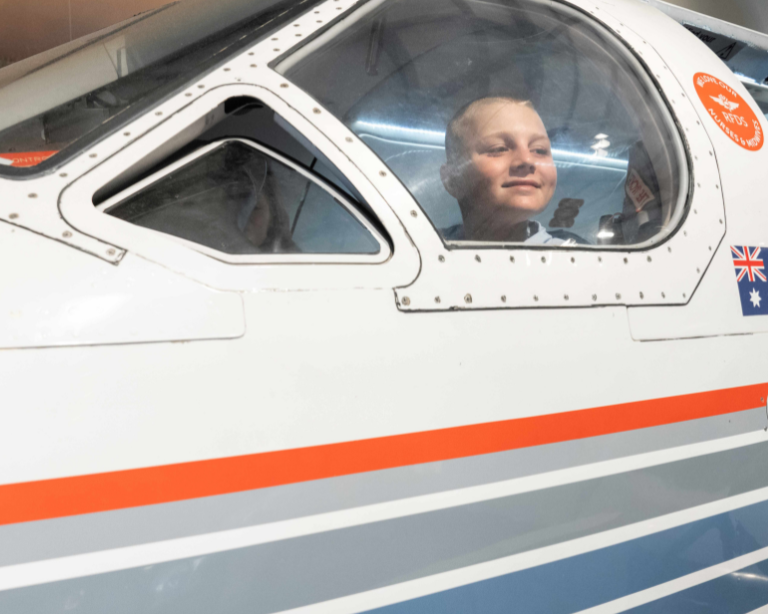 RFDS boy sitting in plane