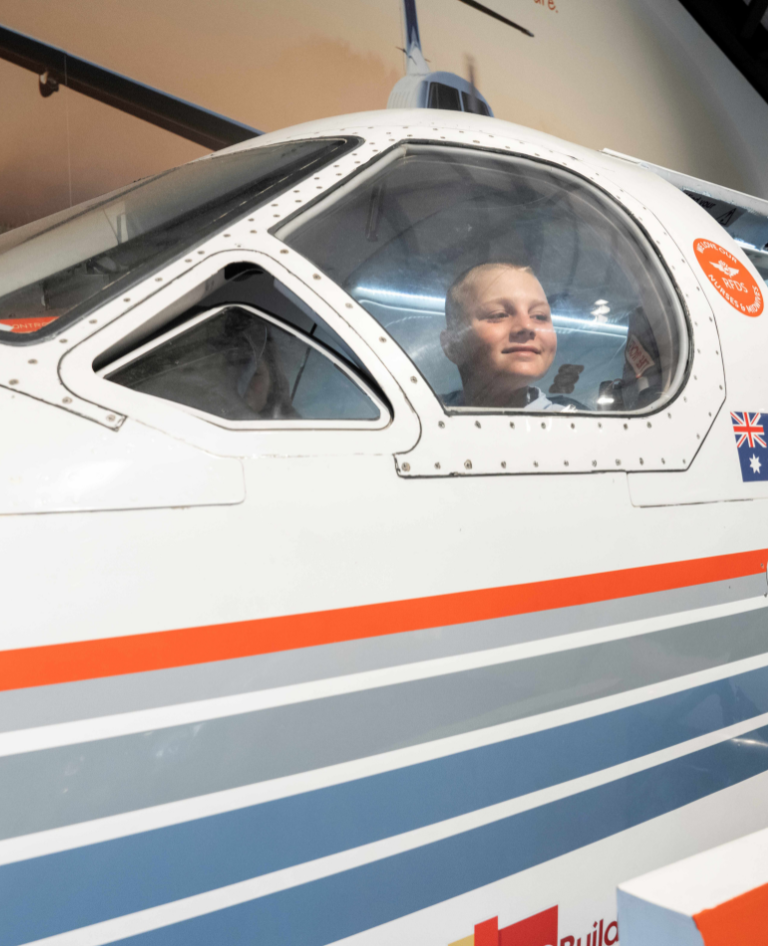 RFDS boy sitting in plane