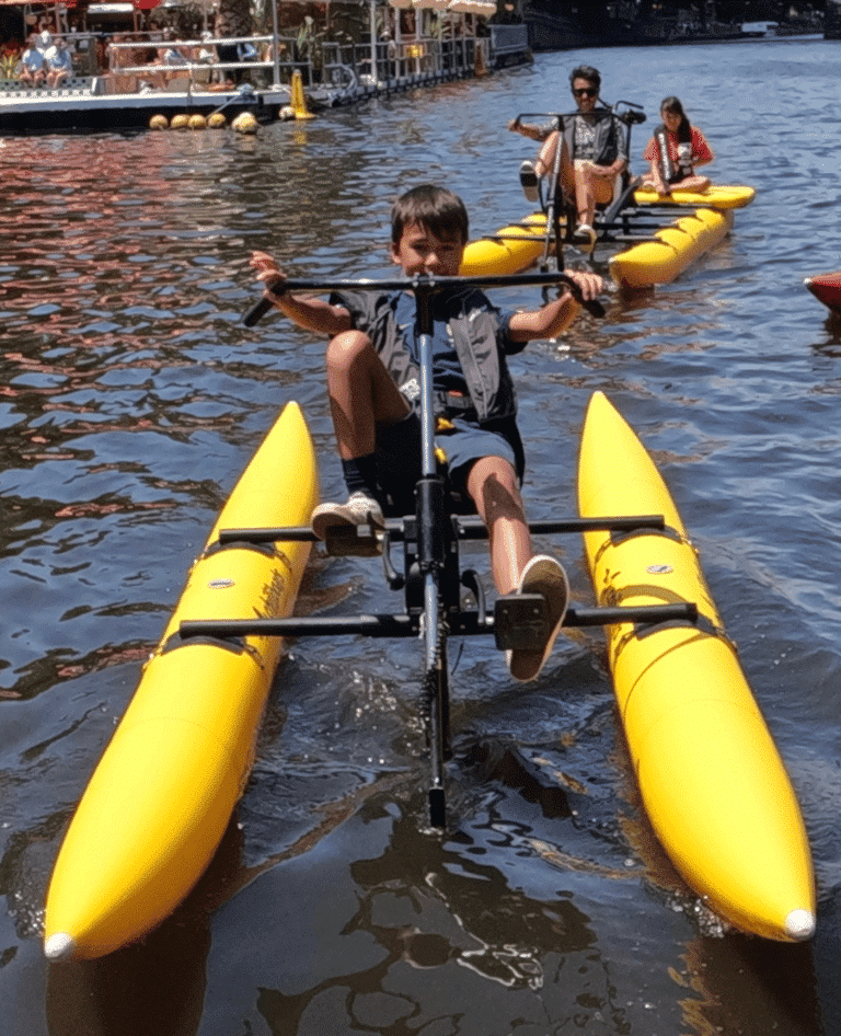 Children exploring Geelong's waterfront on waterbike