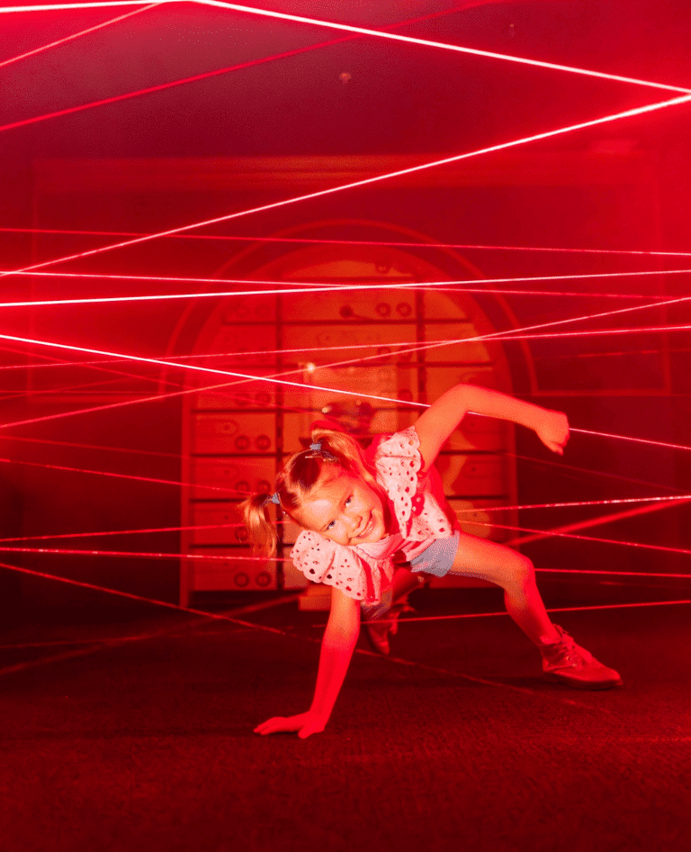 Girl trying to escape the Monopoly Lasers