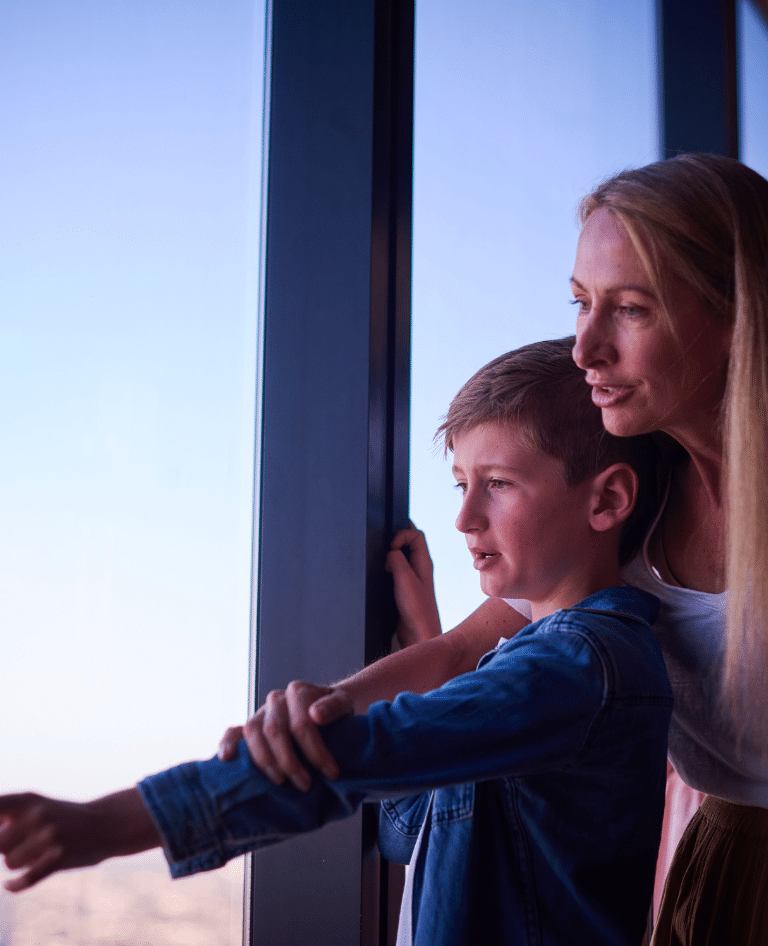 Mum and son enjoying the view from Melbourne Skydeck