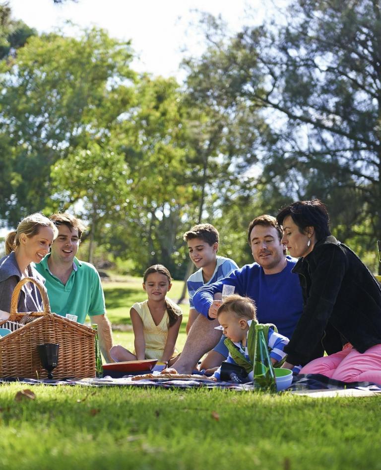 Family enjoying a picnic in the gardens