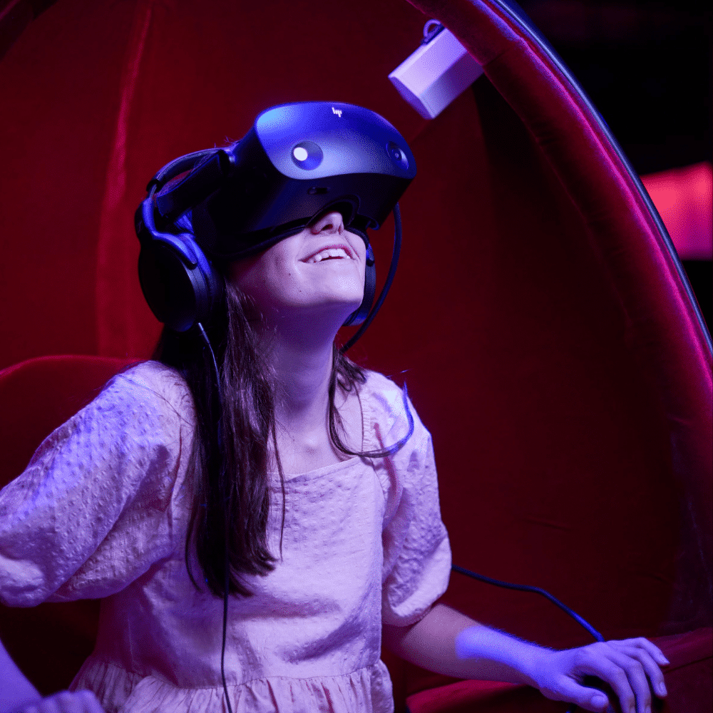 Girl in VR goggles on Voyager Theatre Experience