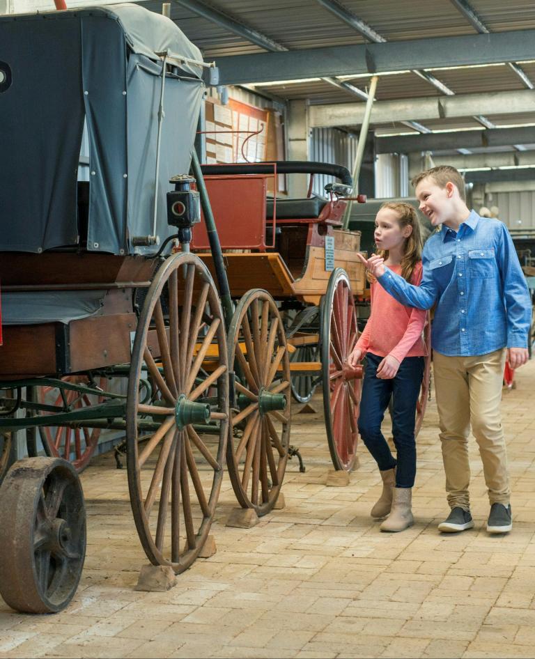 Children looking at carriages