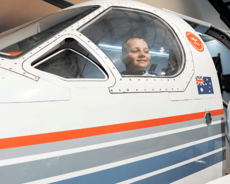 RFDS boy sitting in plane