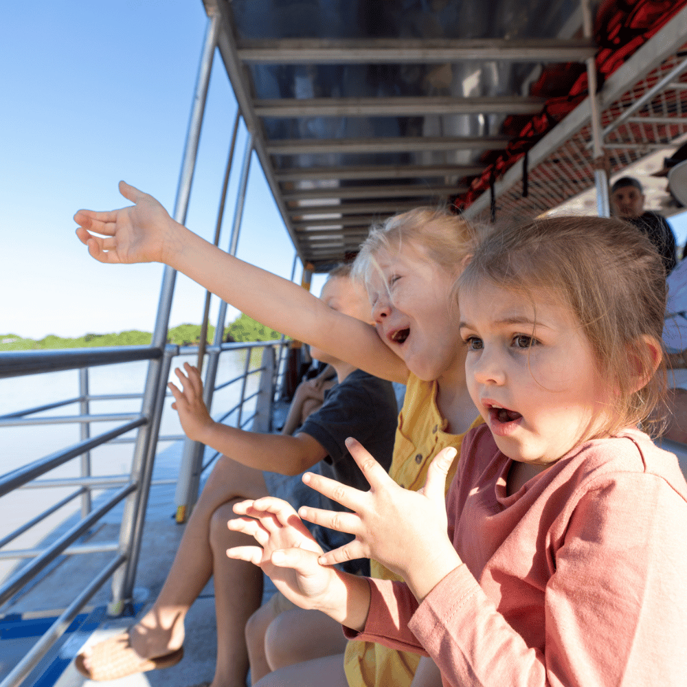 Girls in shock seeing a wild crocodile