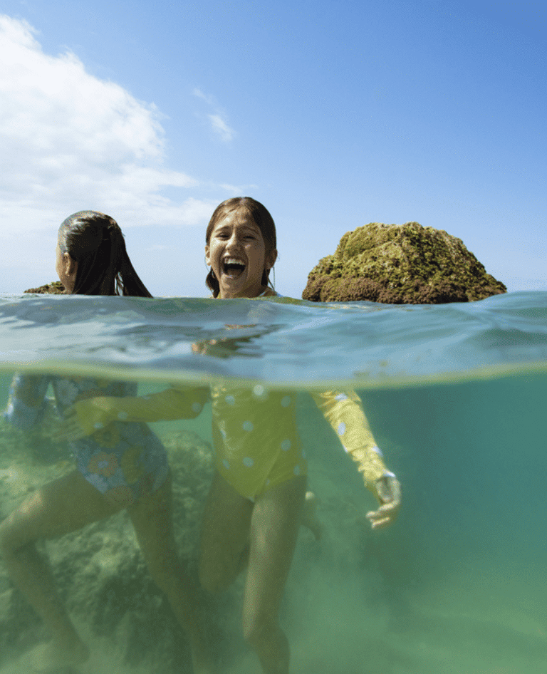 Girls swimming in the beach