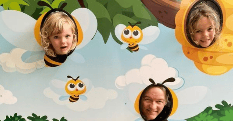 Family at Ginger Factory Bee Wall