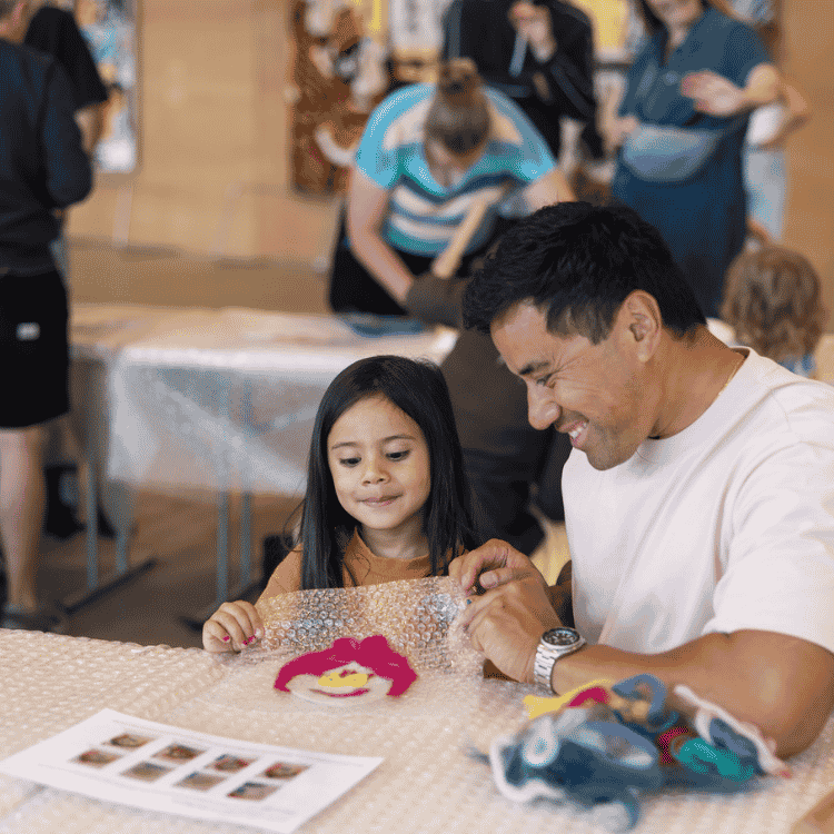 Father with daughter making felt face at HIVE Festival at Art Gallery NSW
